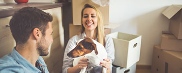 Picture of two people and a dog